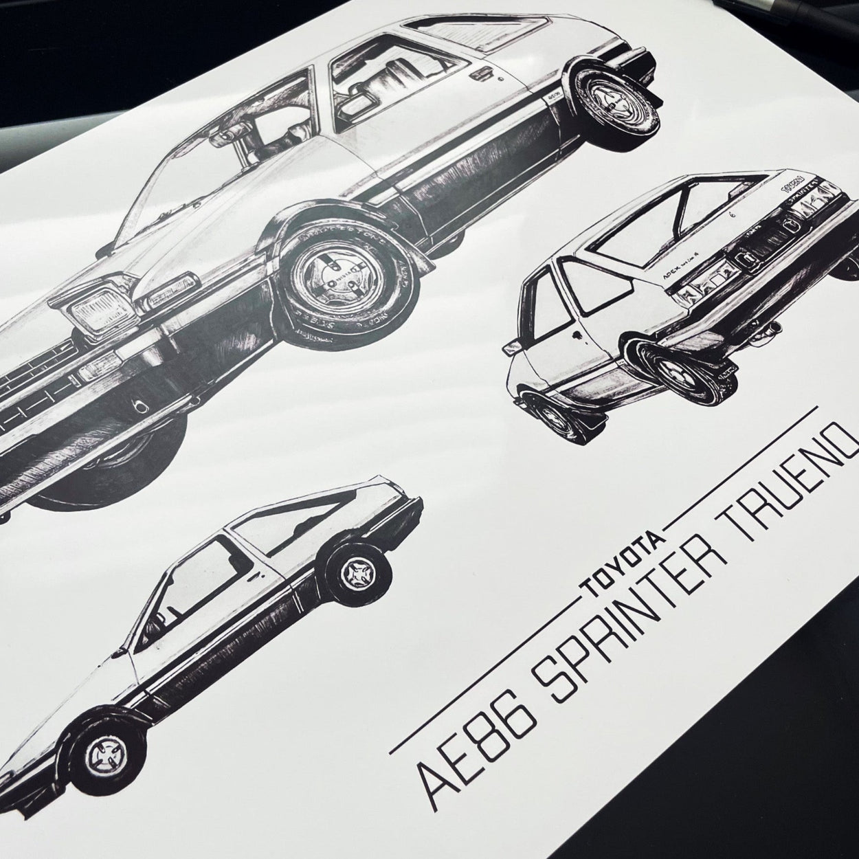 Close up of the poster and fan art print featuring the iconic Toyota AE86 Sprinter Trueno from the legendary manga and anime series, Initial D.