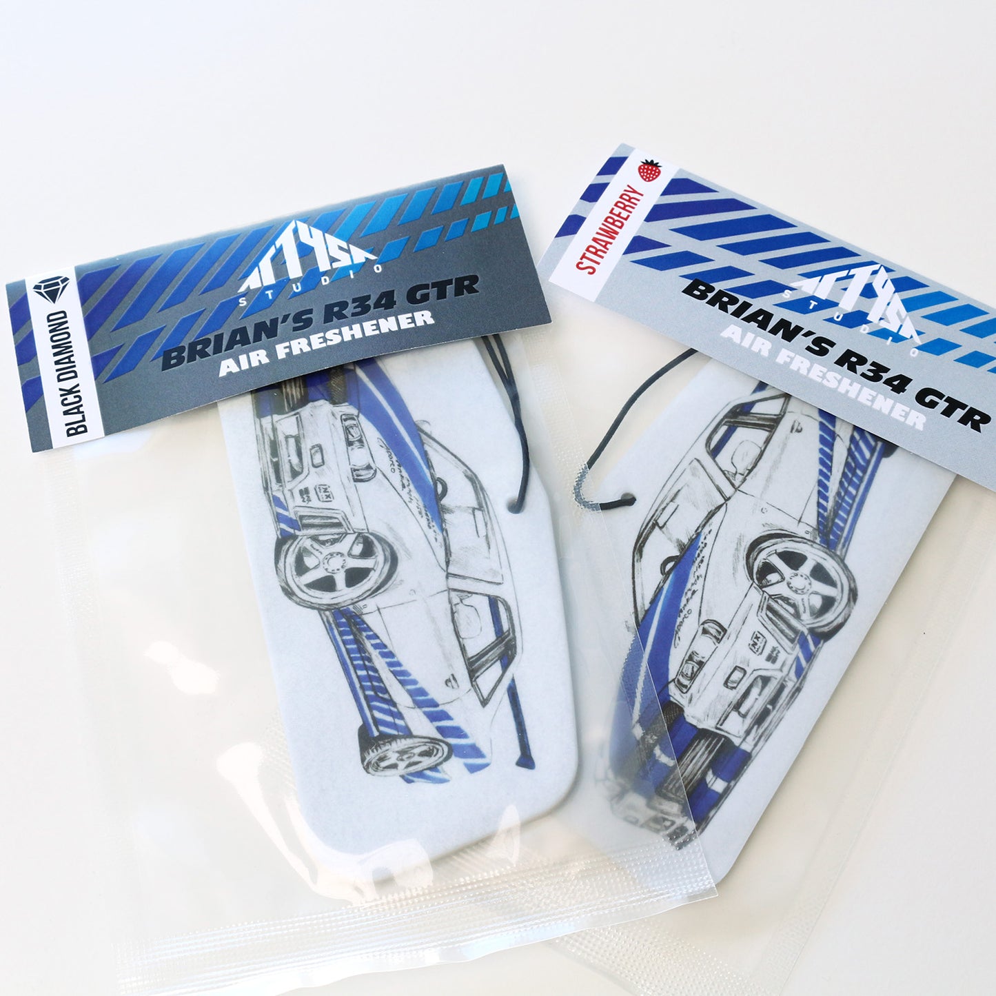 Brian’s R34 GT‑R air freshener sealed in protective packaging with elastic tie.