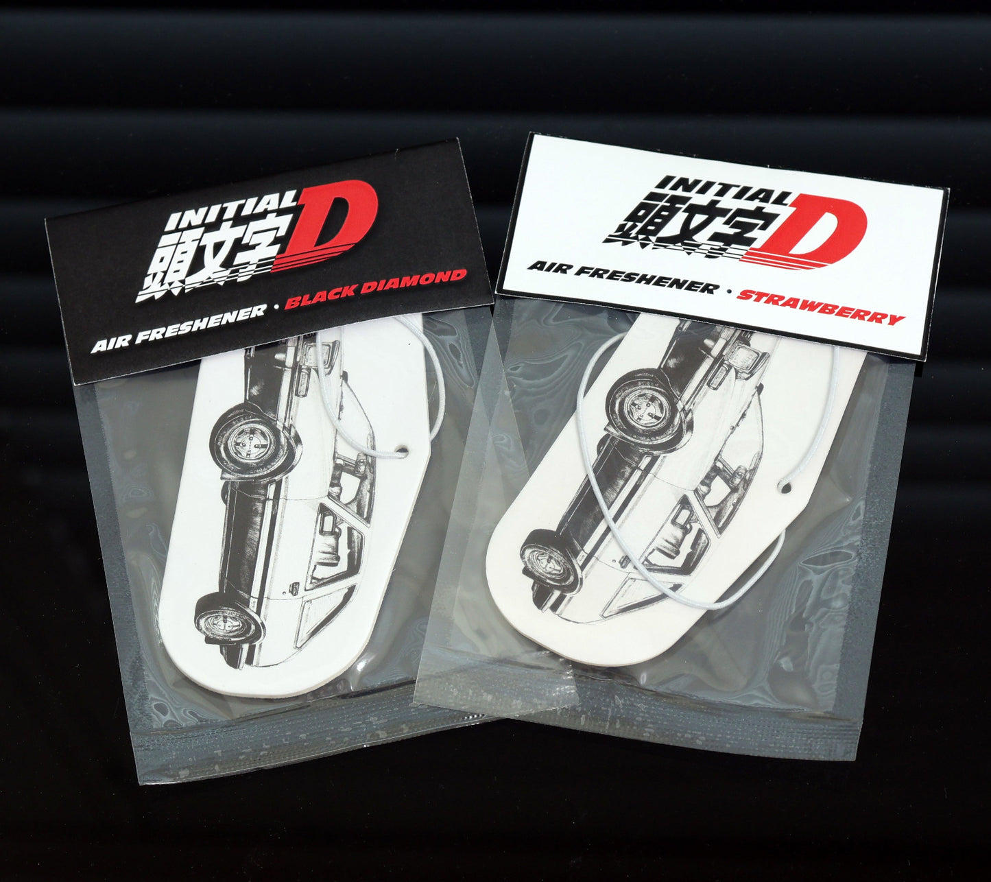 This Initial D AE86 air freshener card currently stock Black Ice or Strawberry scent. Each air freshener comes sealed and each includes an elastic.