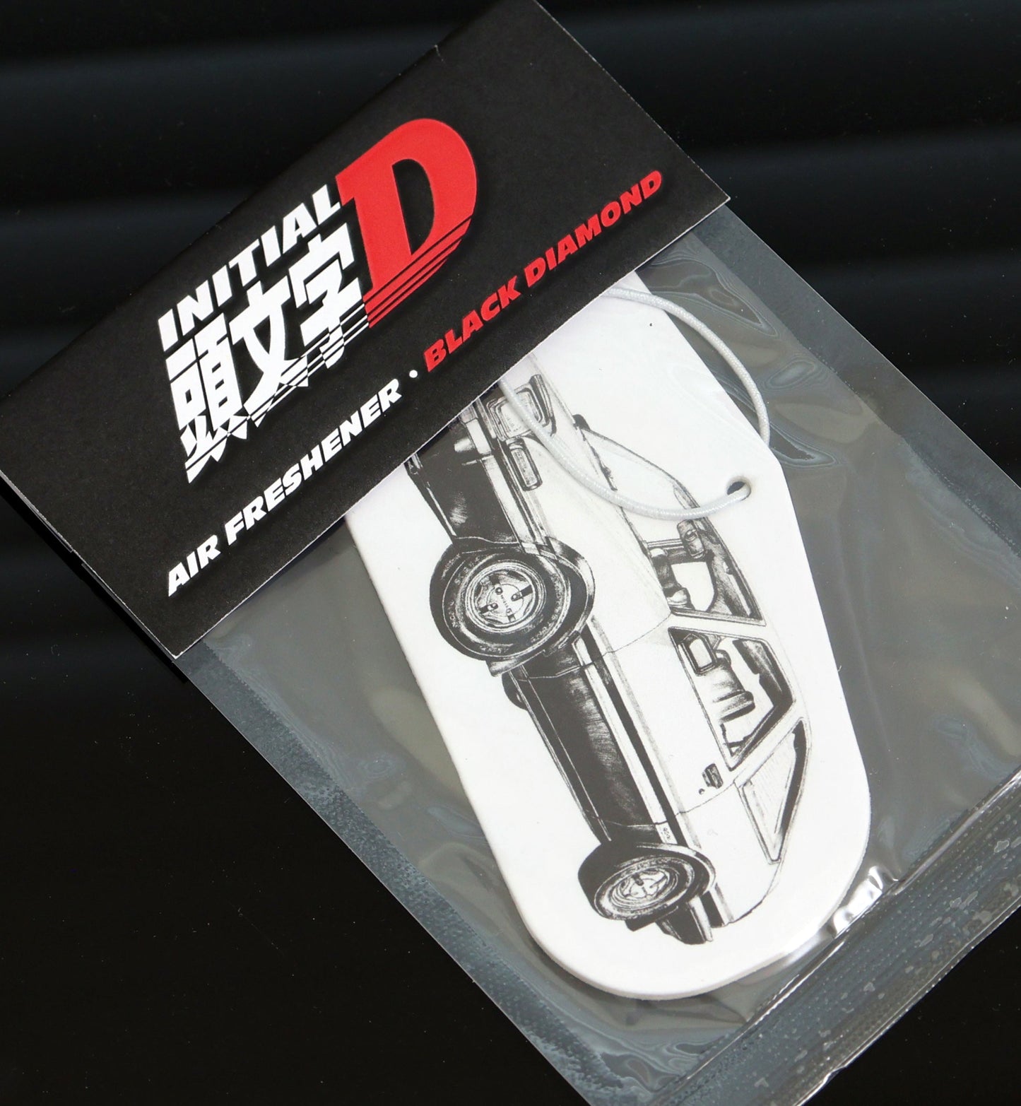 Initial D AE86 air freshener card Black Ice scent, a cool, crisp fragrance that keeps your car smelling fresh.