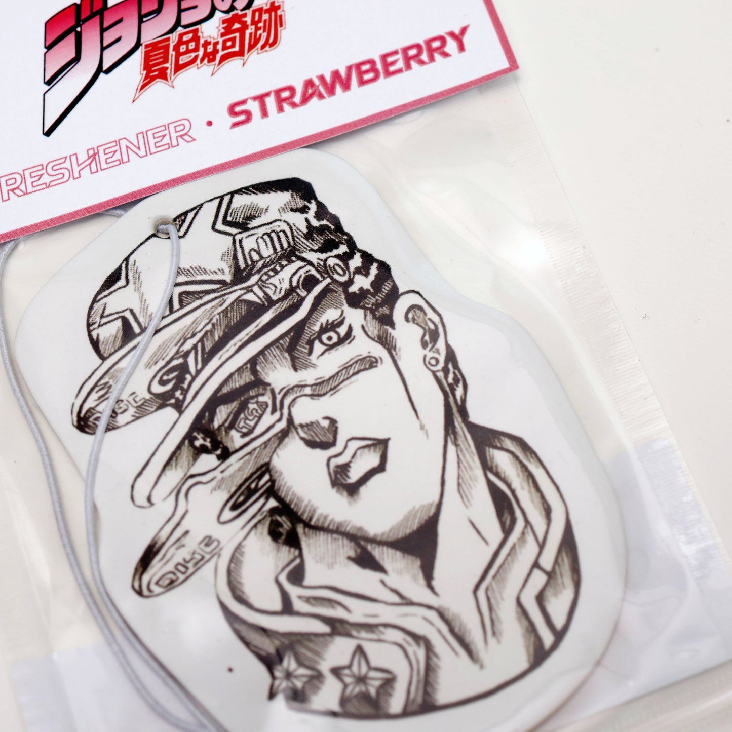Car Air Freshener - Jotaro Kujo's Discs, inspired by Jojo's Bizarre Adventure Strawberry provides a sweet and fruity aroma to uplift your spirits. Each air freshener comes sealed and includes an elastic tie for easy placement.