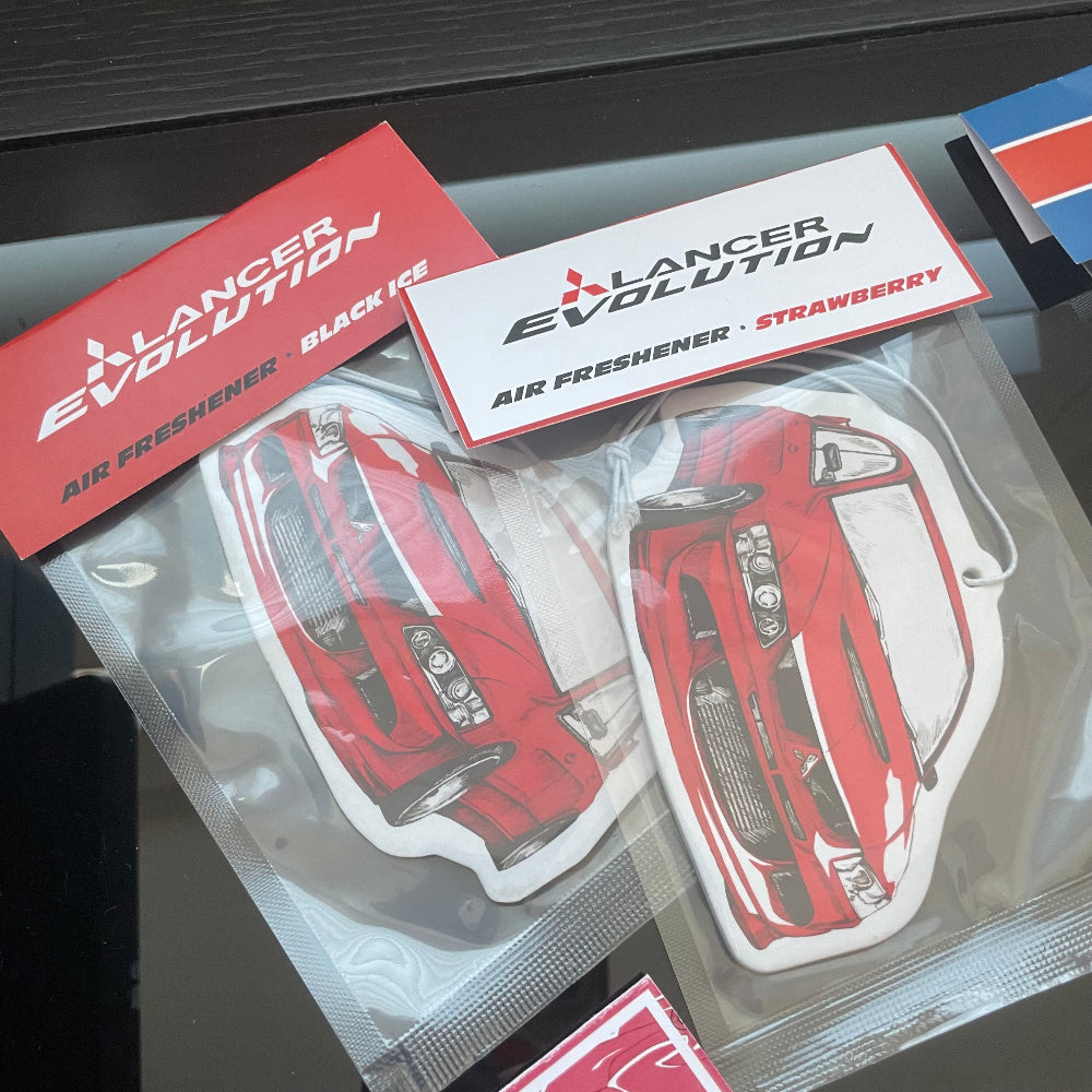 Lancer Evo VIII air freshener card, measures: H: 7cm, W: 10cm. Currently stock Black Ice and Strawberry scent. Each air freshener comes sealed and each includes an elastic tie.