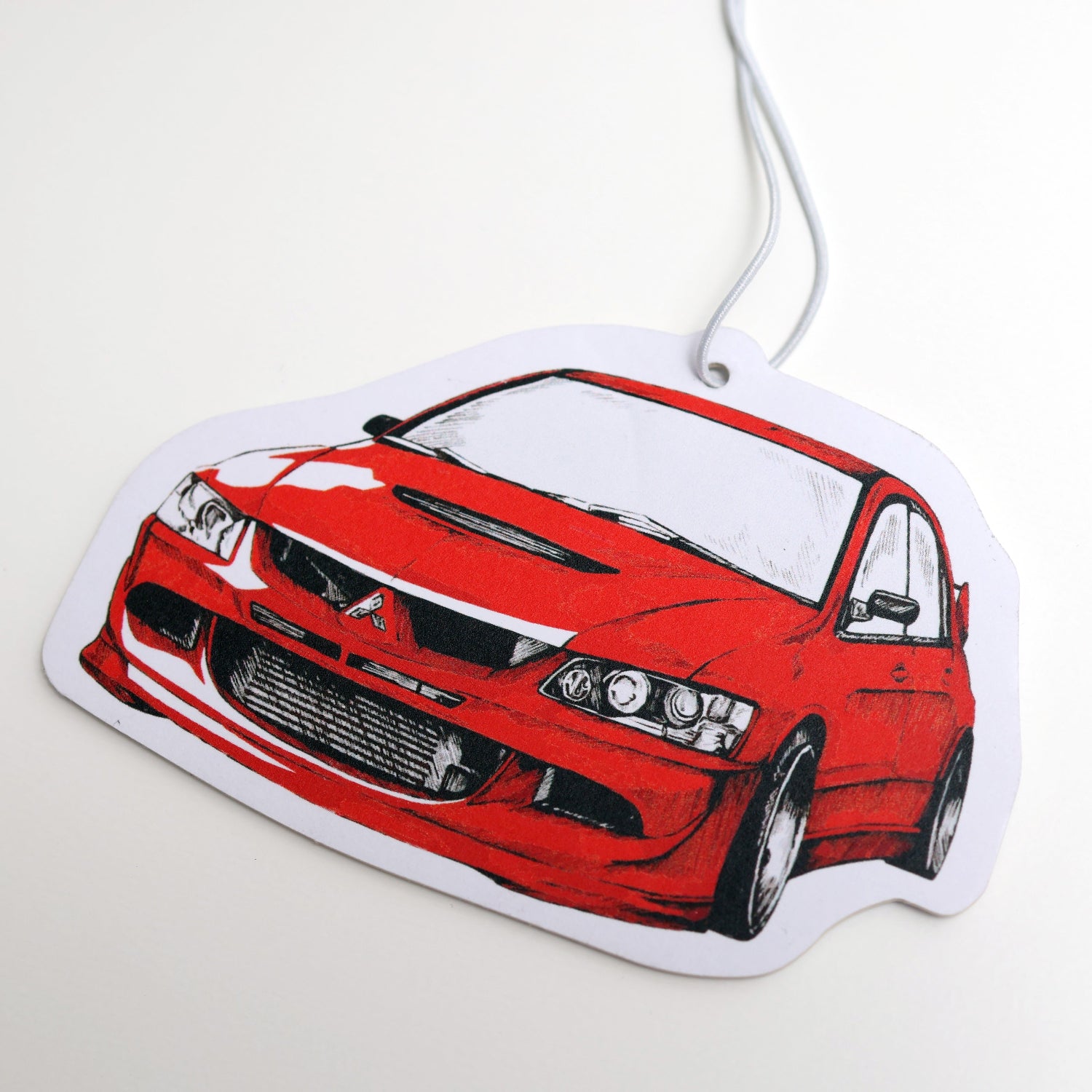Lancer Evo VIII air freshener card closeup.