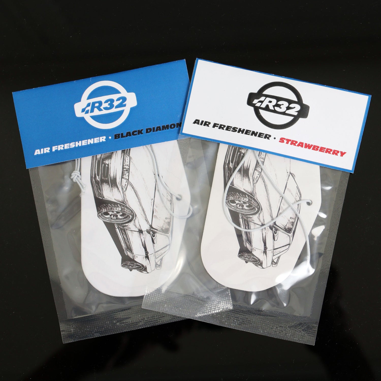 Nissan R32 GT-R Air Freshener, available in two refreshing scents. Measures: H: 5.5cm, W: 10cm. Each air freshener comes sealed and each includes an elastic tie.