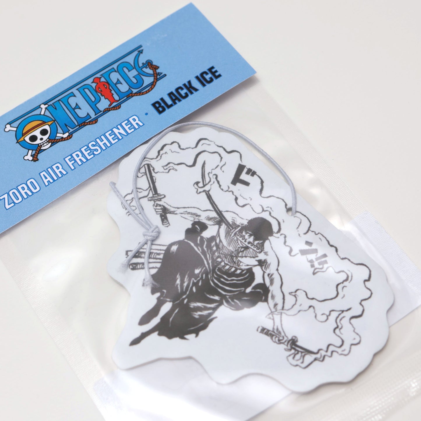 This One Piece Zoro air freshener card Black Ice scent offers a cool, crisp fragrance that keeps your car smelling fresh. Each air freshener comes sealed and includes an elastic tie for easy placement.
