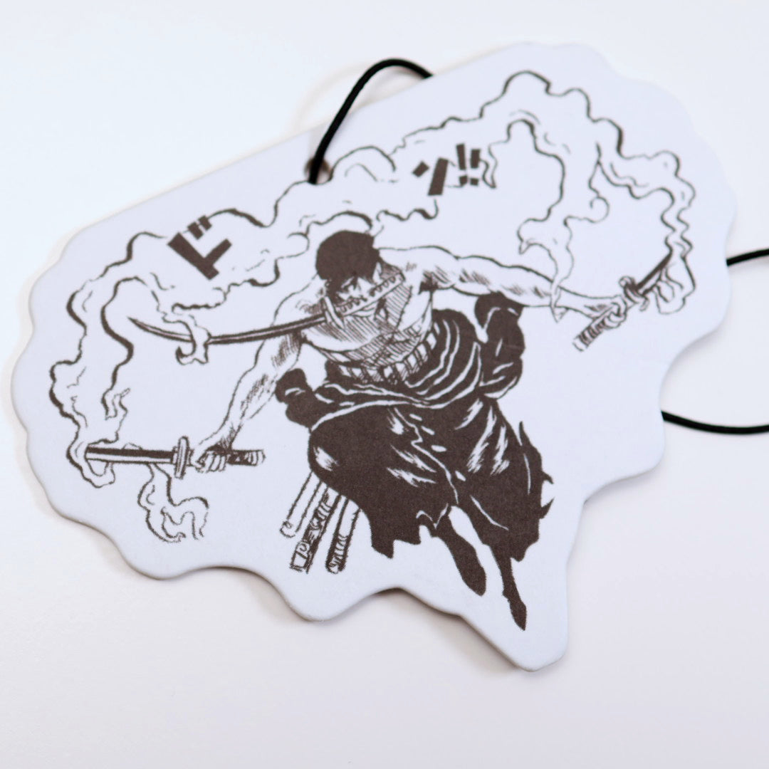 Close up of One Piece Zoro air freshener card design from Entransing's hand drawn artwork. Measuring H: 7.5cm x W: 10cm,