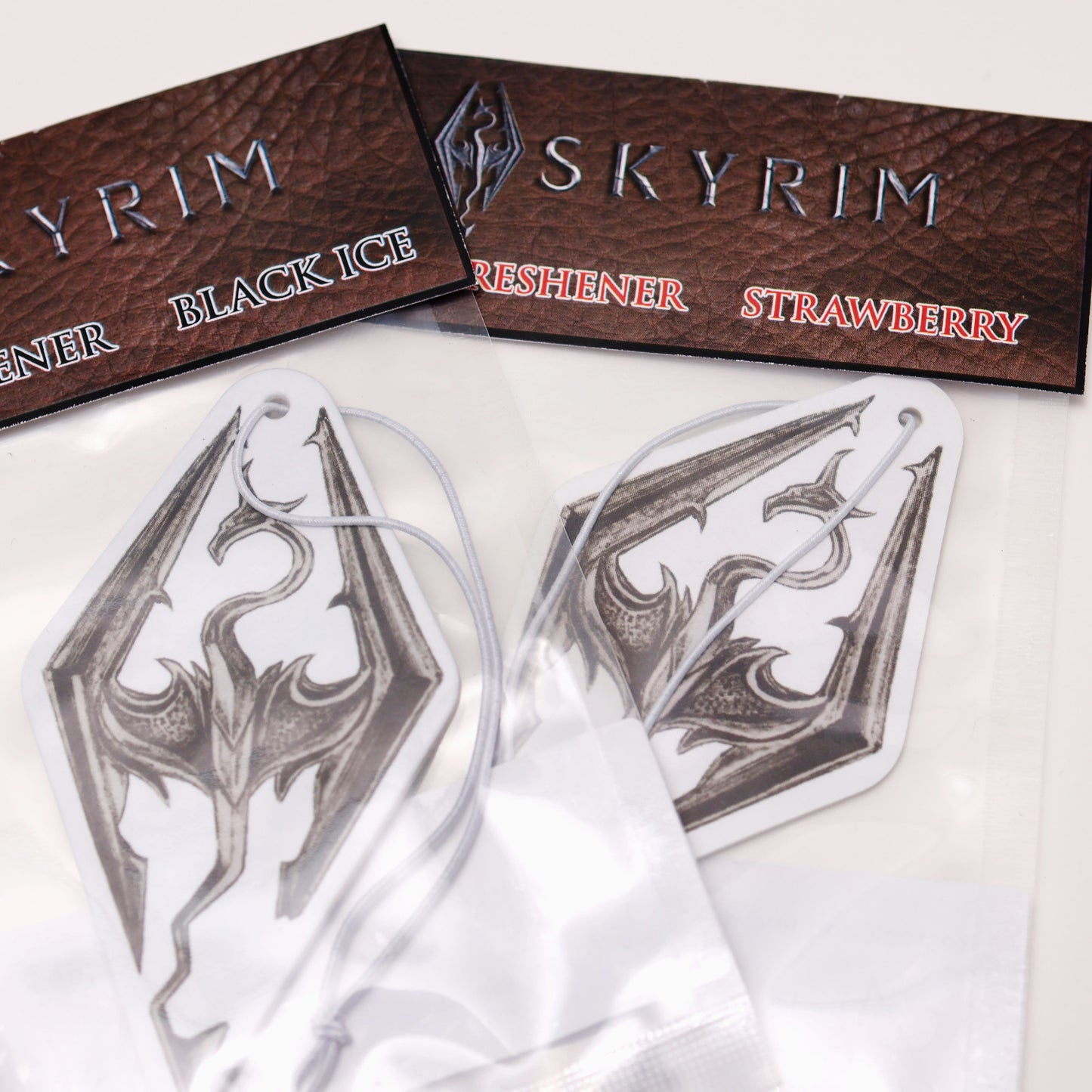 This Seal of Akatosh car air freshener card design inspired by Skyrim available in Black Ice and Strawberry scents.