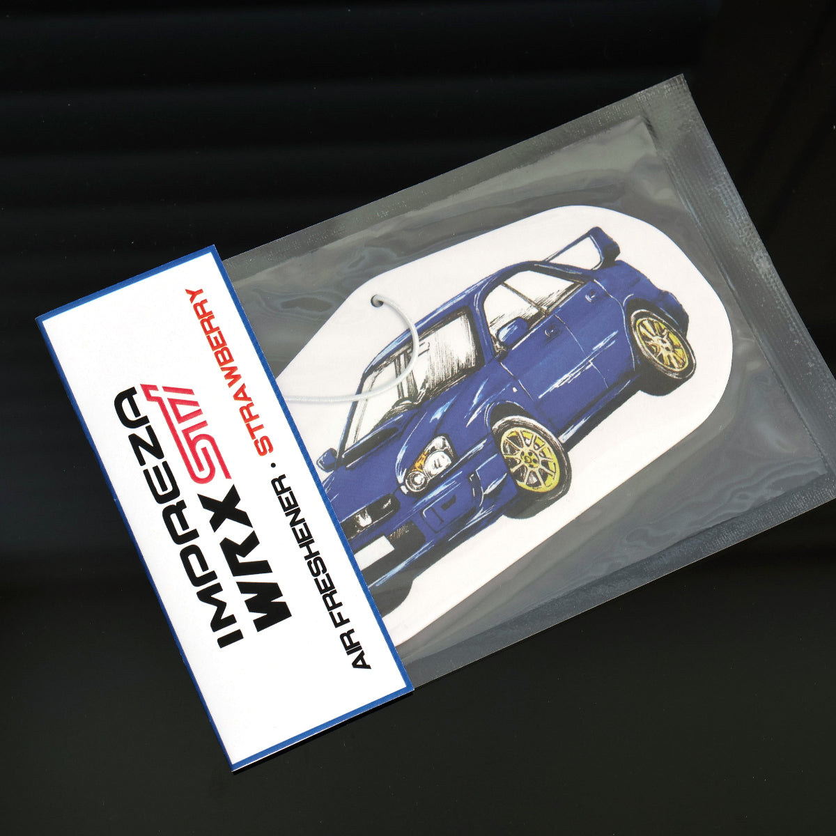 Individually seal packaged Subaru WRX Sti air freshener in strawberry scent