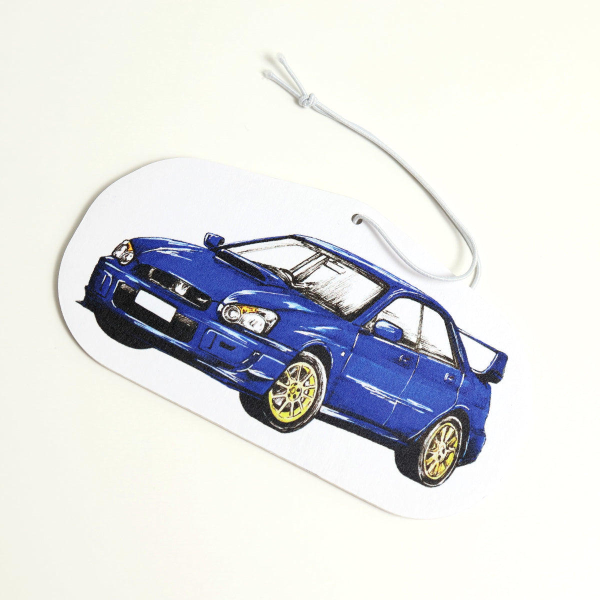 JDM-style, rally-inspired WRX Sti air freshener with elastic tie, ready for display
