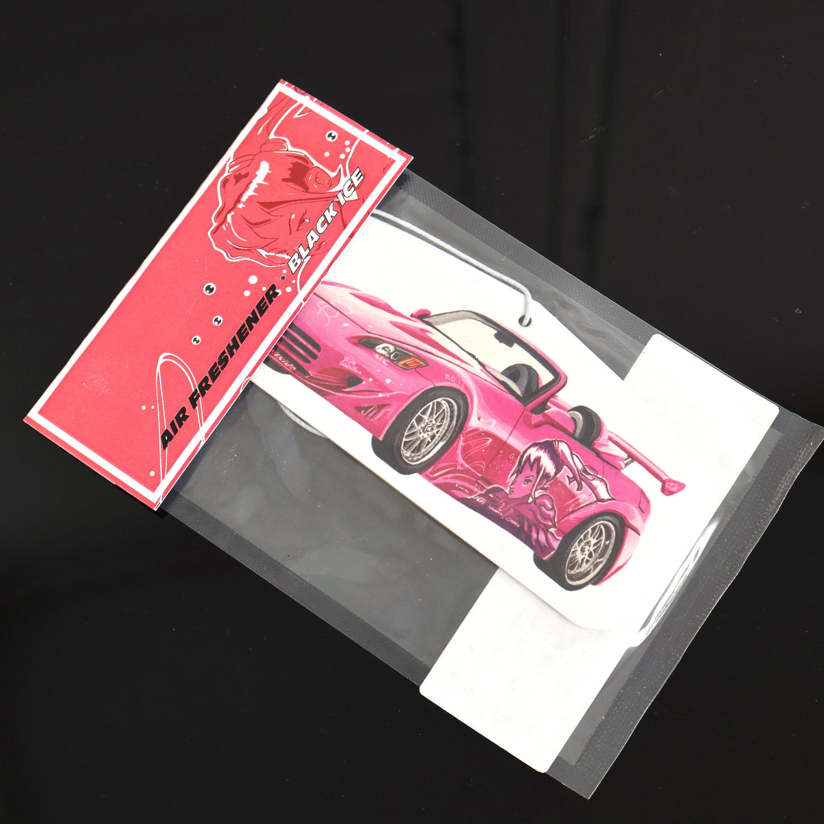 Suki S2000 car air freshener inspired by Fast and Furious Black Ice, offers a cool, crisp fragrance. Each air freshener comes sealed and includes an elastic tie for easy placement.