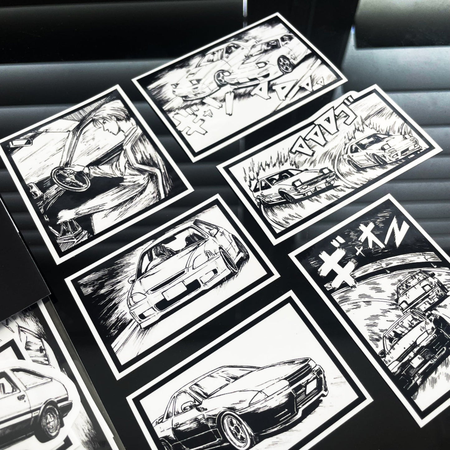Initial D vinyl sticker pack featuring 7 hand‑drawn JDM car designs from Mt. Akina.