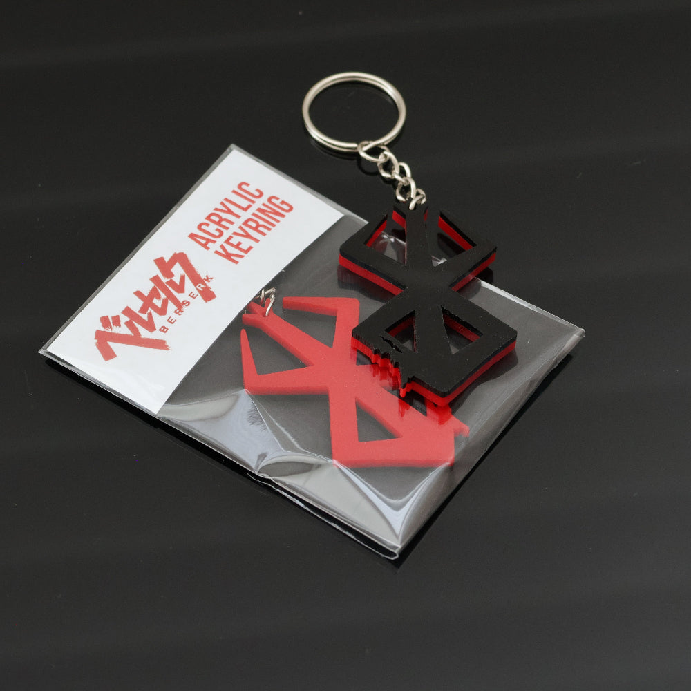 This Berserk Brand of Sacrifice Keyring/keychain made from two layers of gloss finish acrylic with one side red, one side black.