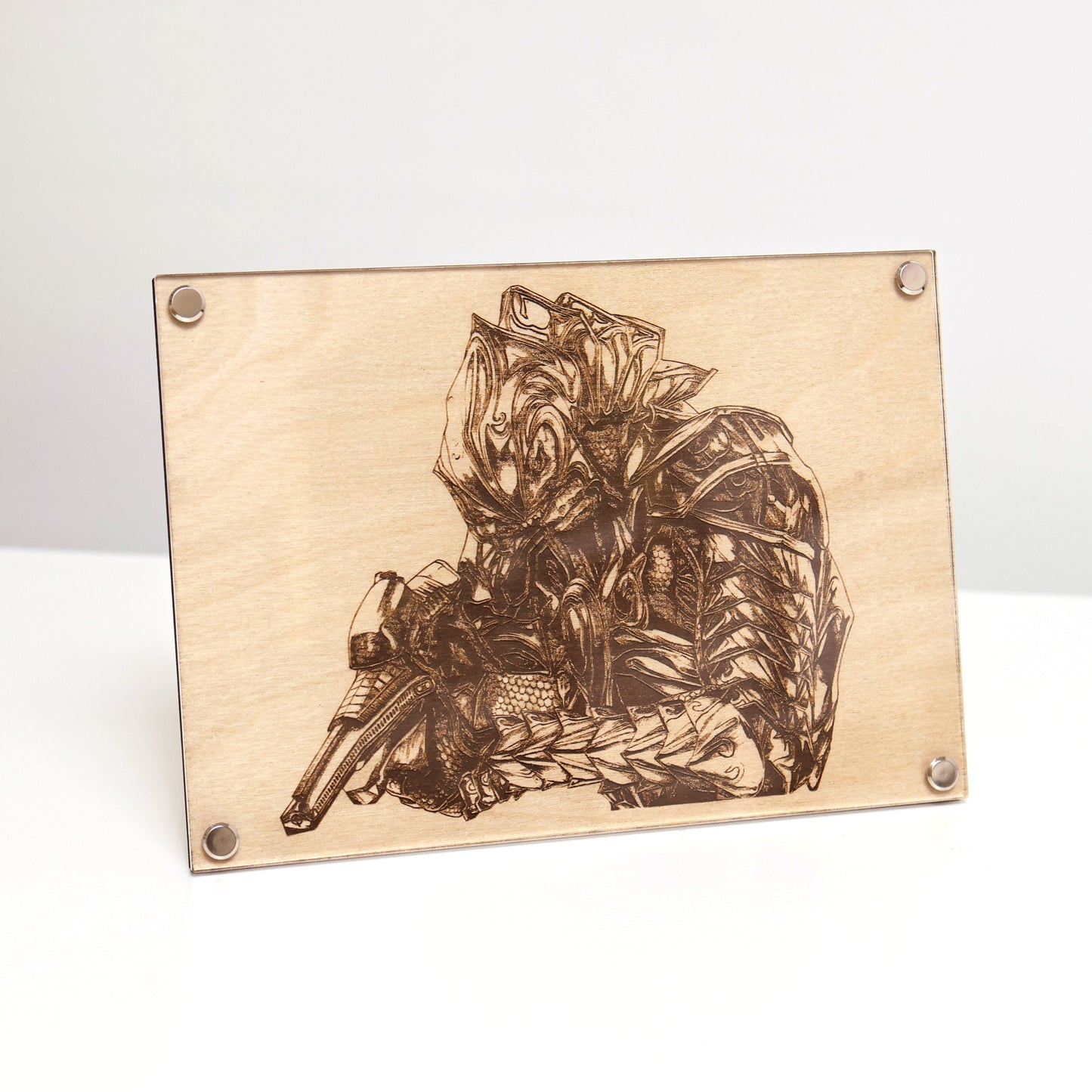 Laser‑engraved birch wood plaque featuring The Arbiter portrait inspired by Halo, crafted as a detailed LayaBoard art piece on a table.