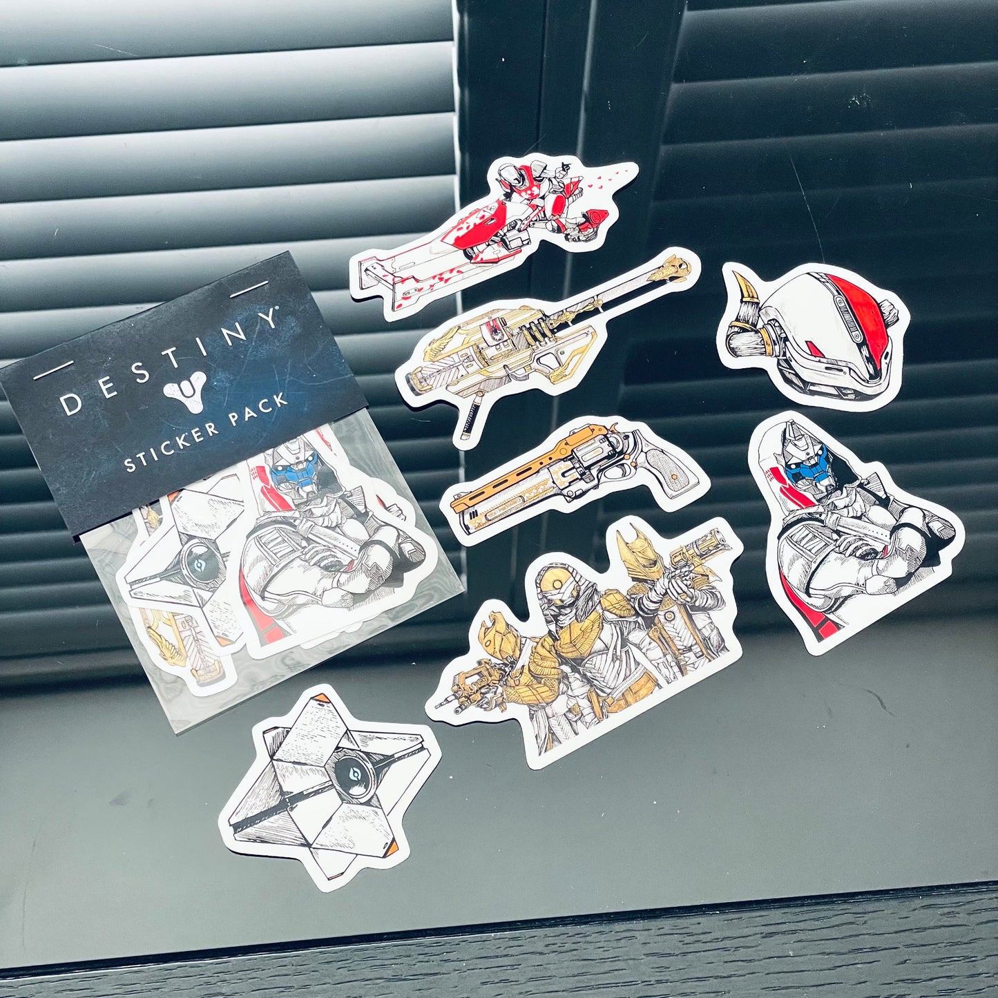Destiny sticker pack featuring 7 vivid vinyl designs: Cayde-6, Ghost, Gjallarhorn, Lord Shaxx, Crimson Days Sparrow, Trials of Osiris, and Tex Mechanica.