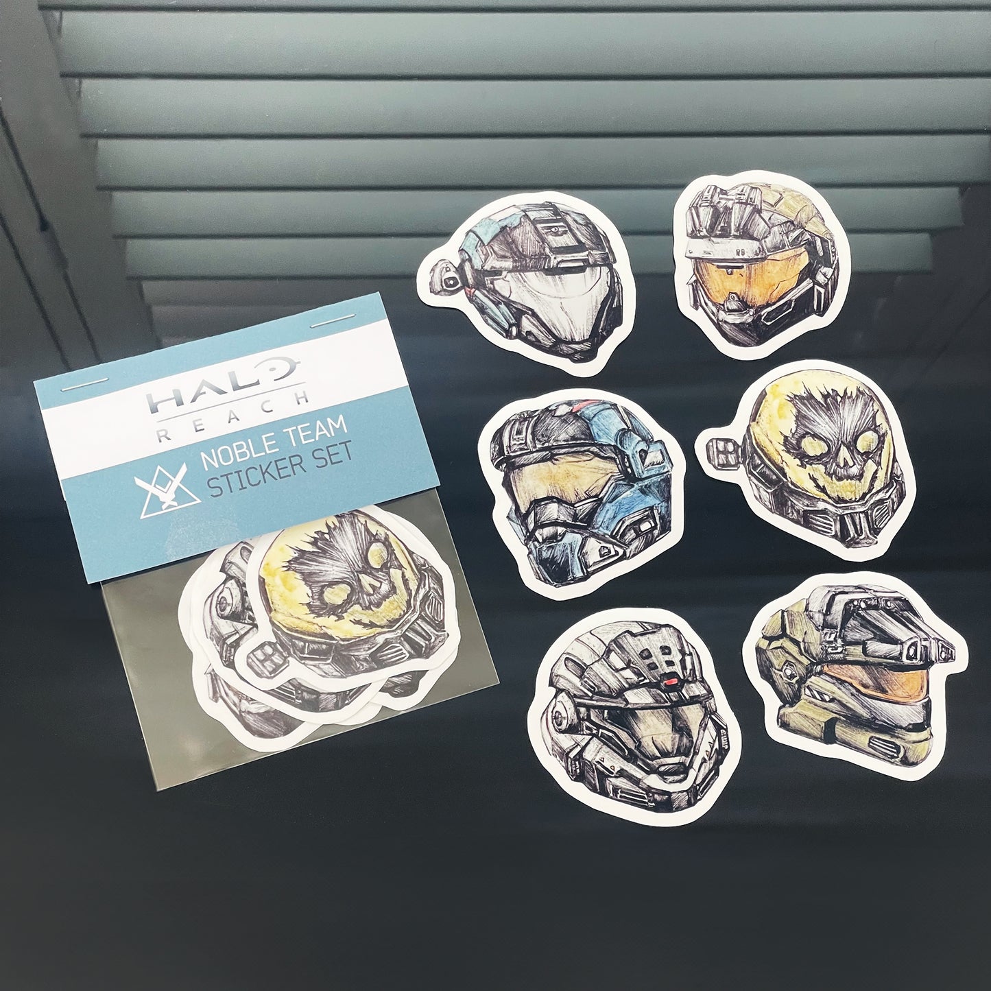 Halo Reach: NOBLE Team Vinyl Sticker Pack. High-quality vinyl stickers with vivid colors and sharp image clarity, showing details of 6 original designs of each member of NOBLE Team, all hand-drawn and designed by Entransing.