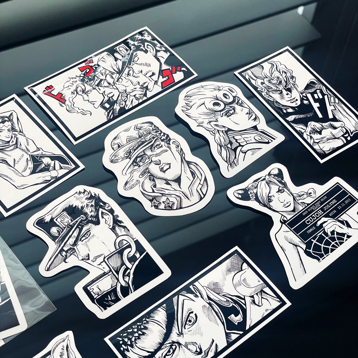 Closeup of Jojo's Bizarre Adventure Sticker Pack featuring 9 original designs inspired by Jojo's Bizarre Adventure.
