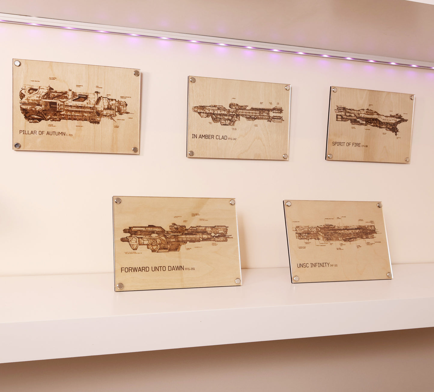Custom made Halo inspired, laser engraved plaque of five individual UNSC ship diagram bundle, encased in LayaBoard Art frame design dislayed on shelve.