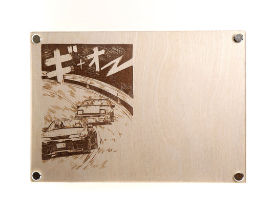 A stylish noting board for Nissan GT-R lover and all JDM enthusiasts. It features a laser engraved manga scene of GT-R racing AE86 on one side and a blank writing area on the other.