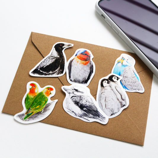 This Australian bird art vinyl stickers pack includes 6 stickers: 1 x Kookaburra, 1 x Magpie, 1 x Love Birds, 1 x Budgerigar, 1 x Babies Emperor penguin, 1 x Welcome Swallow. Made from high quality vinyl, these stickers are beautifully vivid in colour and capture each iconic Australian bird in stunning detail. 