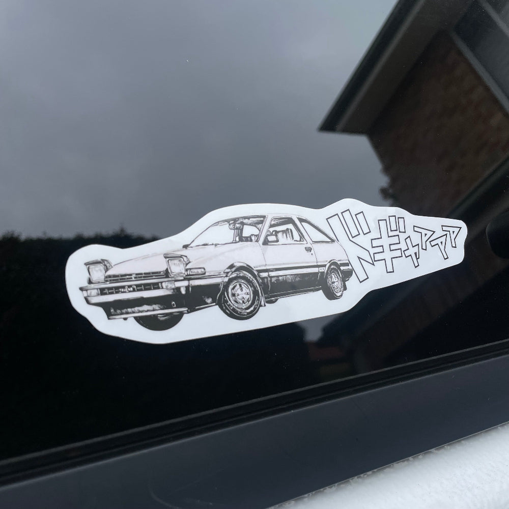 The perfect gift for Initial D art enthusiasts, this Initial D - AE86 decal features a vinyl base and lamination, making it suitable for both indoor and outdoor use. It's ideal for decorating your car, personal belongings, or simply for adding to your art collection. Dimension: Approx. 19cm x 5 cm