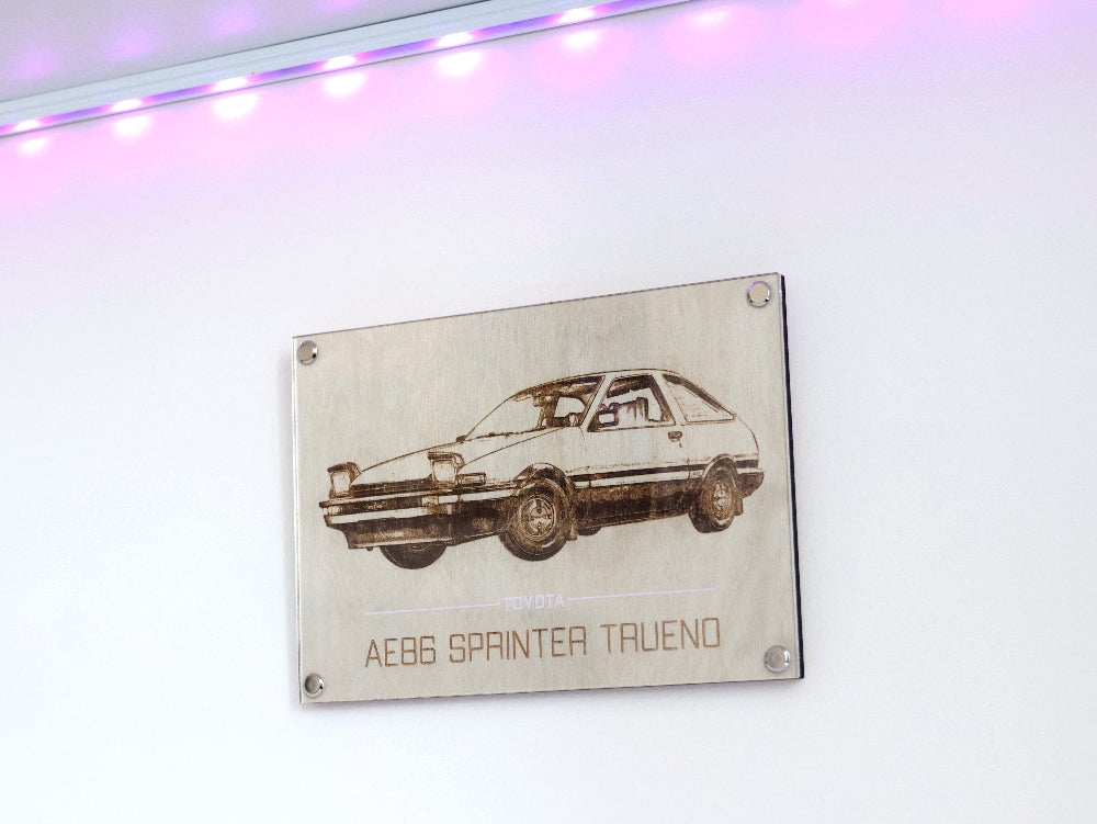 Inspired by the iconic manga, Initial D, this stunning laser engraved artwork of Toyota AE86 Sprinter Trueno in manga style is the ultimate fusion of JDM car culture with a blend of classic and modern aesthetics, makes it a unique wall art.