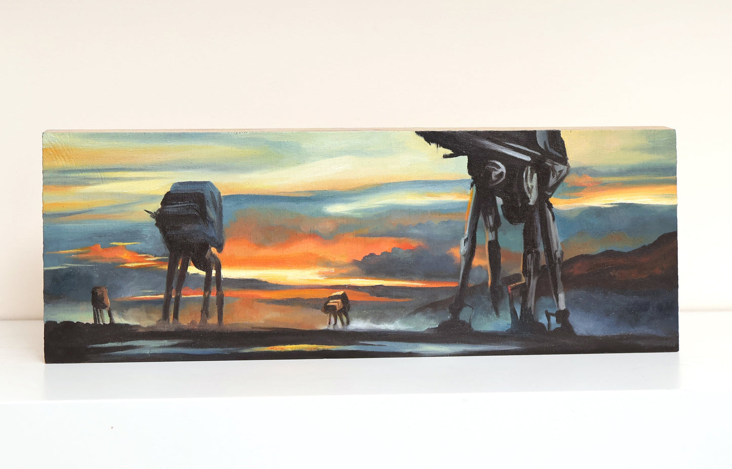 Original oil painting on wood panel depicting silhouetted AT-AT walkers from Star Wars marching across a misty landscape at sunset. Vivid orange, yellow, and blue tones create a dramatic sci-fi atmosphere, with bold contrast and cinematic composition.