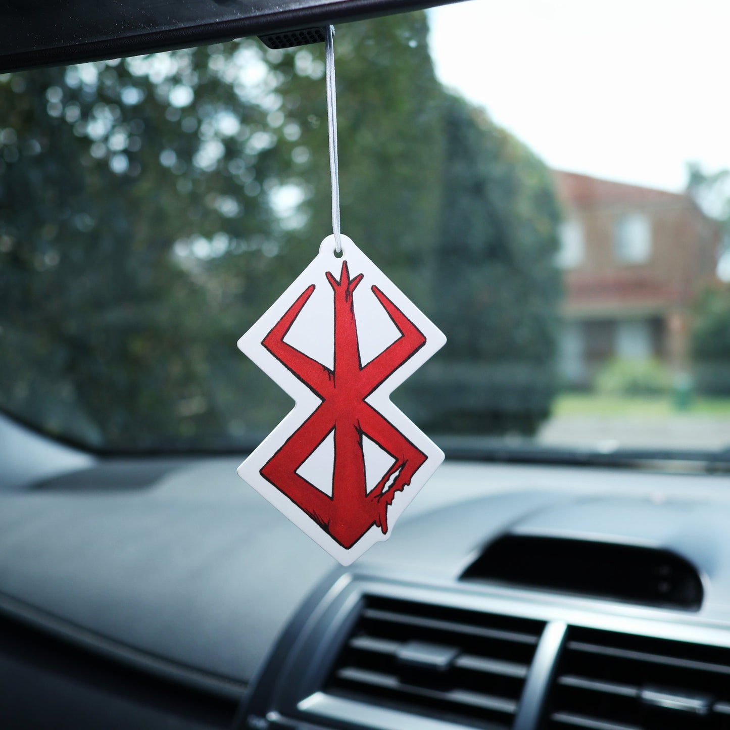 This Berserk Brand of Sacrifice car air freshener card is ideal for adding a touch of style to your car while keeping the air fresh.