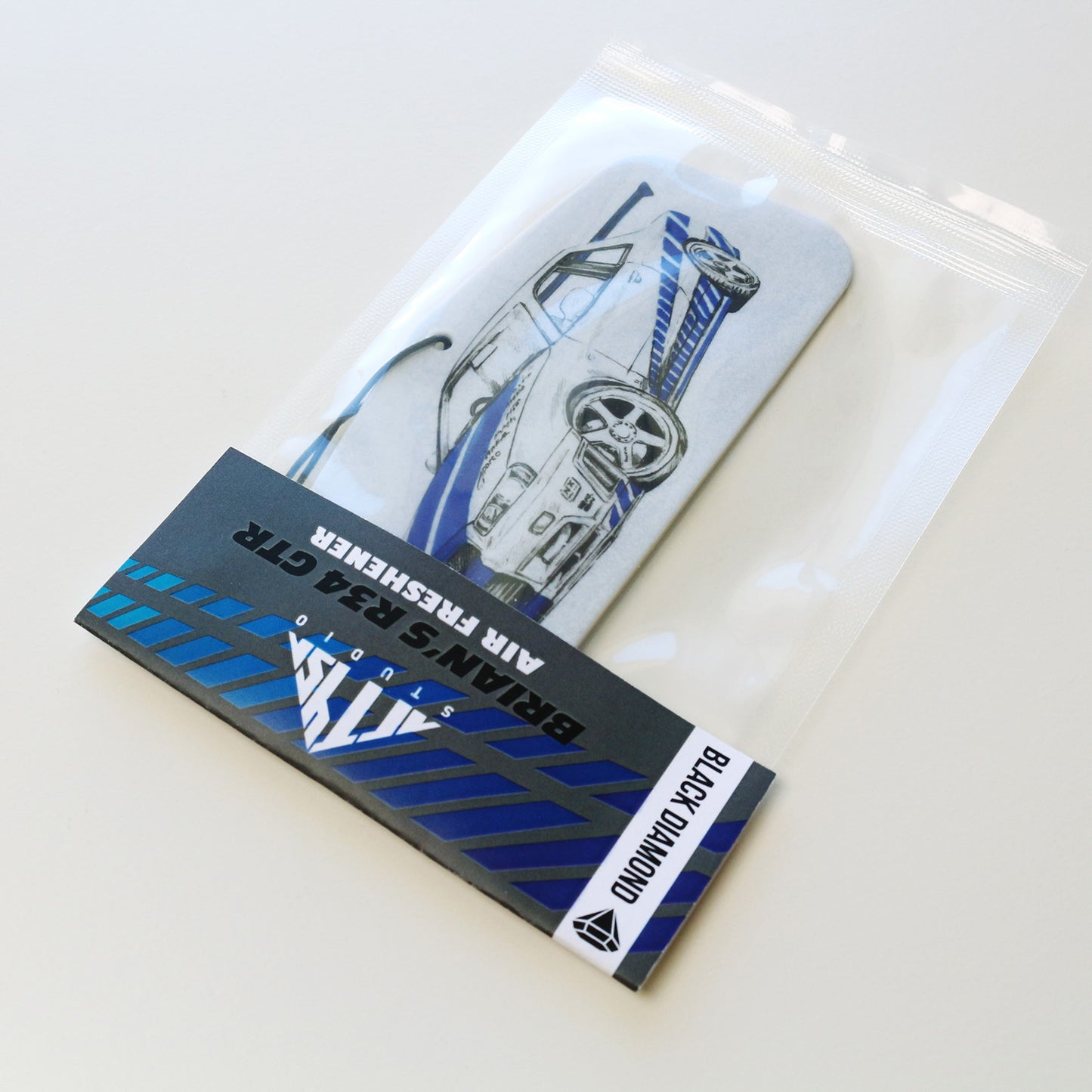 Packaged R34 GT‑R air freshener black diamond scent featuring blue Skyline artwork.