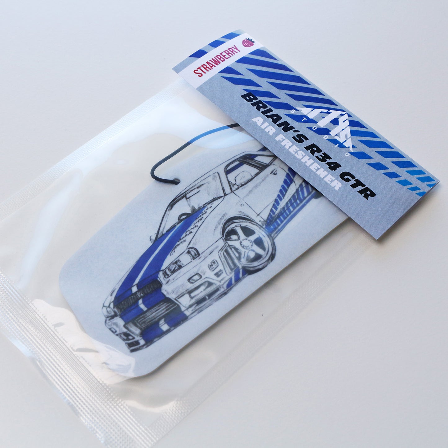 Packaged R34 GT‑R air freshener strawberry scent featuring blue Skyline artwork.
