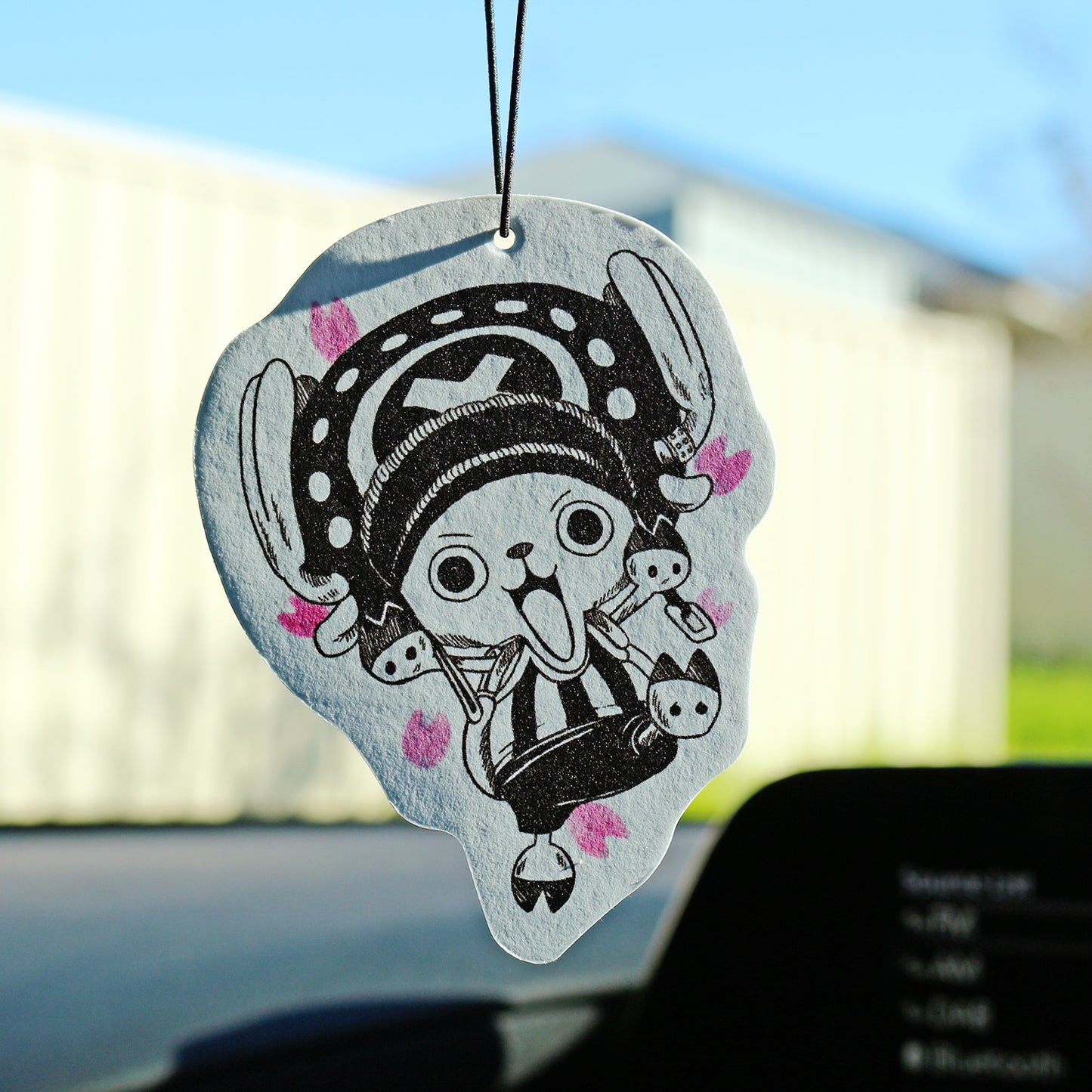 One Piece‑inspired Chopper air freshener displayed in vehicle interior.