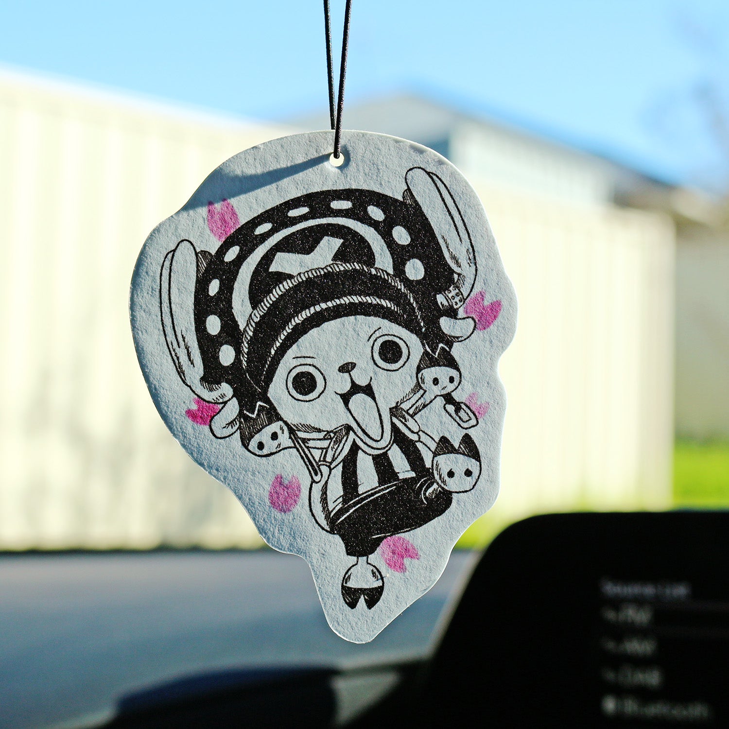 One Piece‑inspired Chopper air freshener displayed in vehicle interior.
