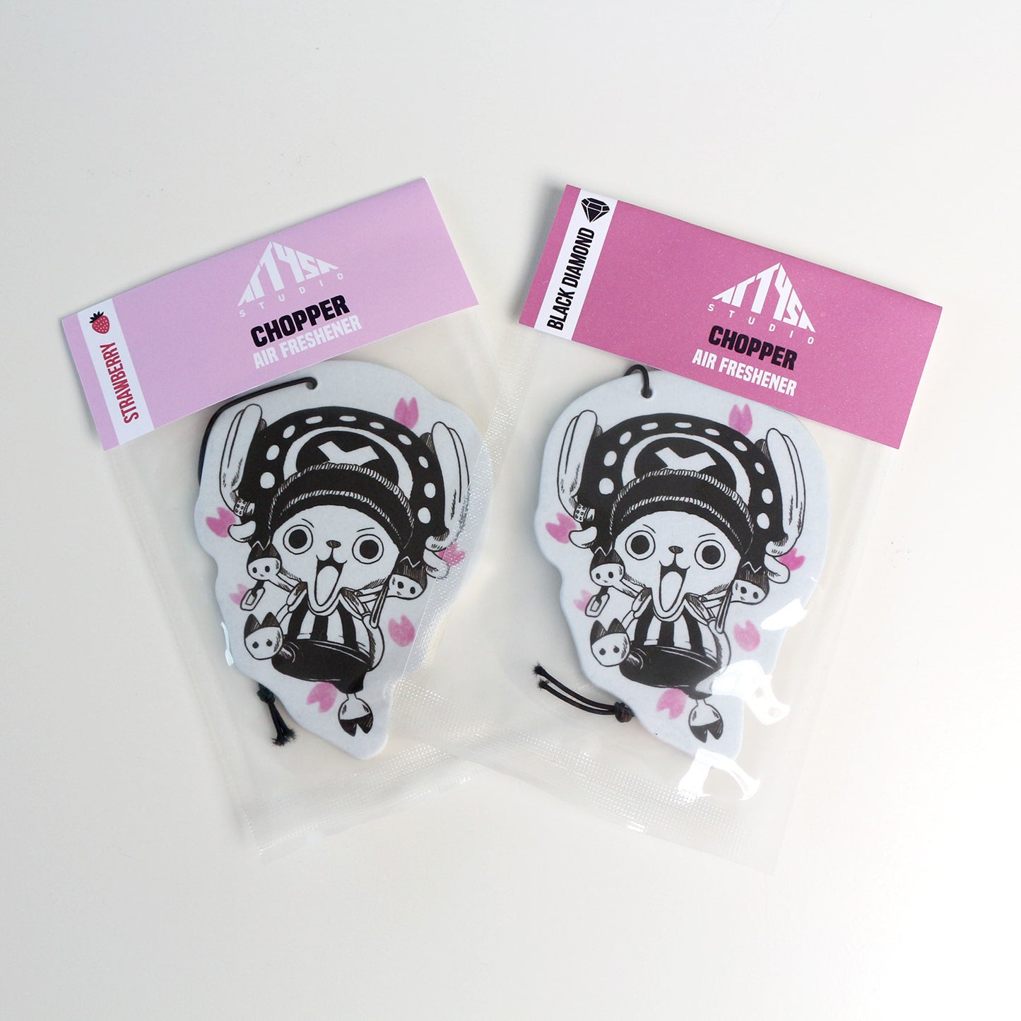 Packaged Chopper car air freshener sealed with elastic tie and scent options Black Diamond and Strawberry.