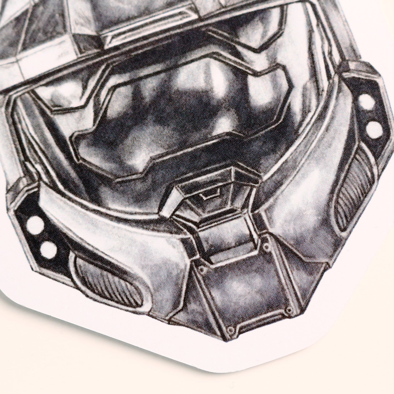 Zoomed view of printed Master Chief illustration on car air freshener surface.