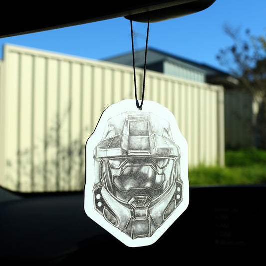 Master Chief car air freshener hanging from rear‑view mirror inside vehicle.