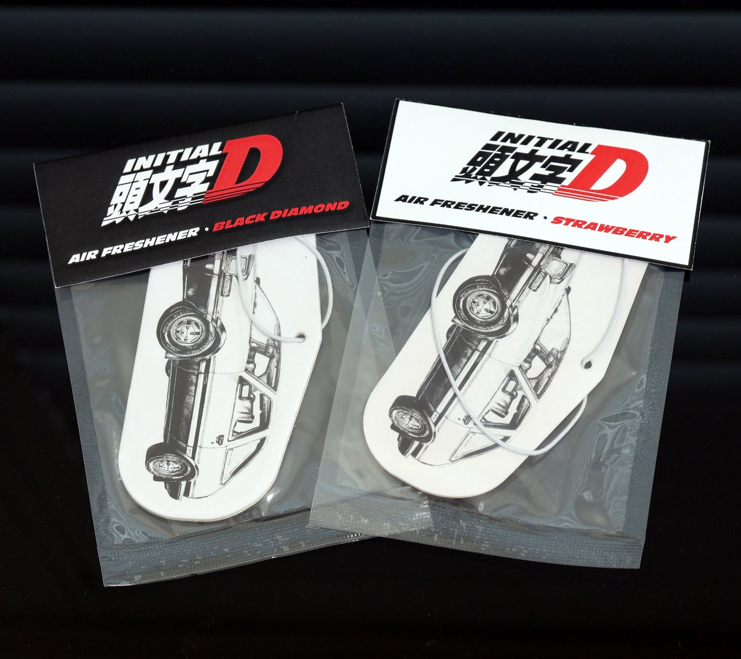 This Initial D AE86 air freshener card currently stock Black Ice or Strawberry scent. Each air freshener comes sealed and each includes an elastic.