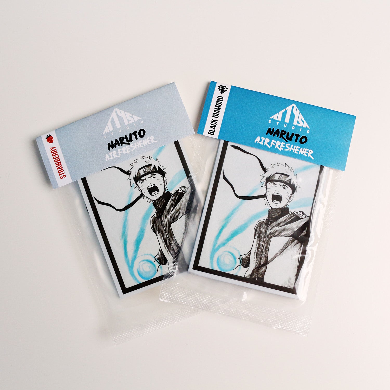 Naruto manga air freshener with Black Ice or Strawberry scent in sealed packaging.