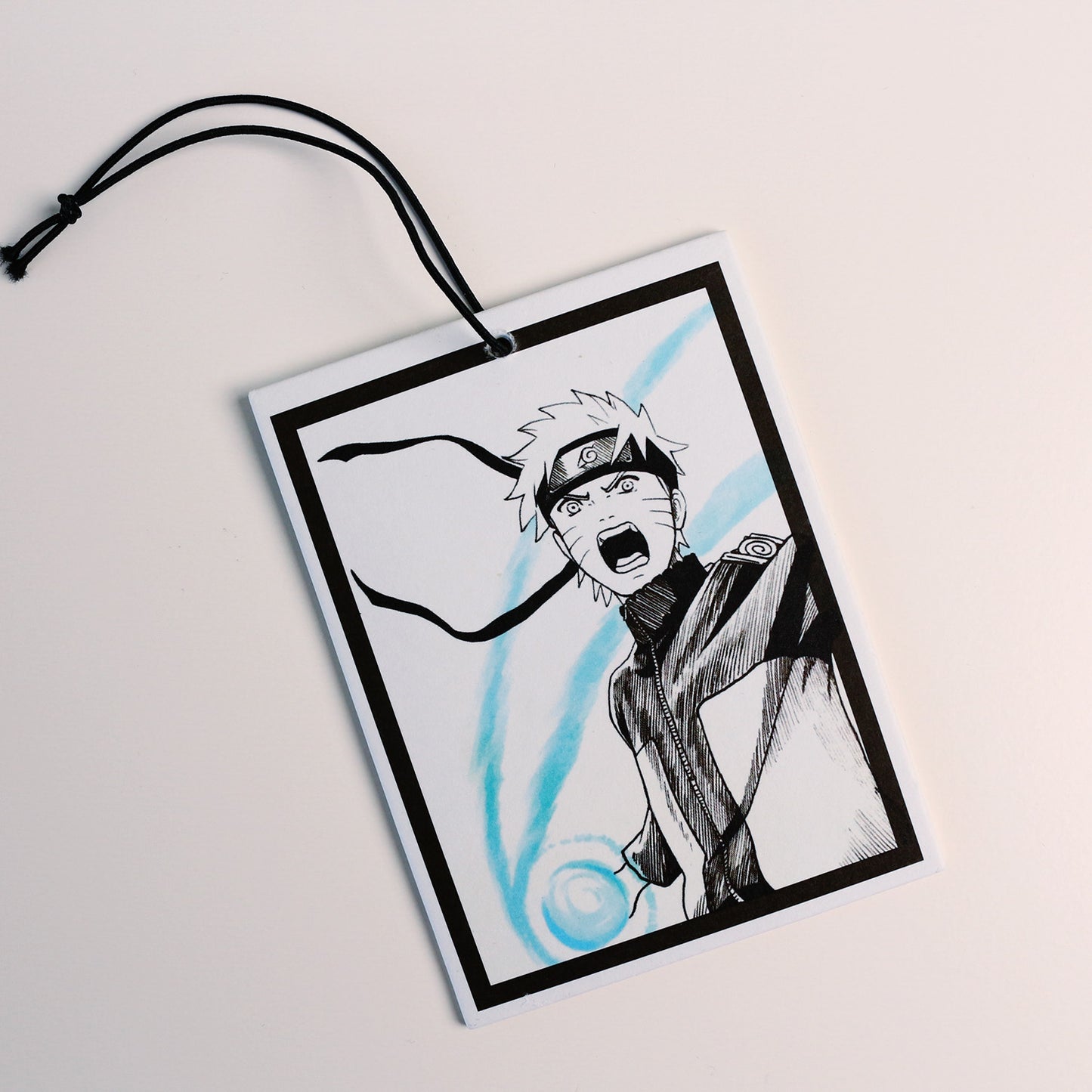 Naruto manga‑style illustration printed on car freshener card