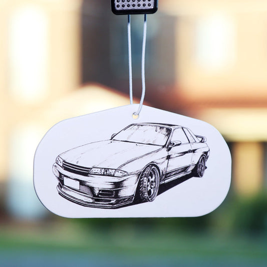 JDM-inspired, Nissan R32 GT-R Air Freshener, designed for Skyline enthusiasts and automotive art collectors. Featuring a hand-drawn illustration, this air freshener adds a stylish touch while keeping your car smelling fresh.