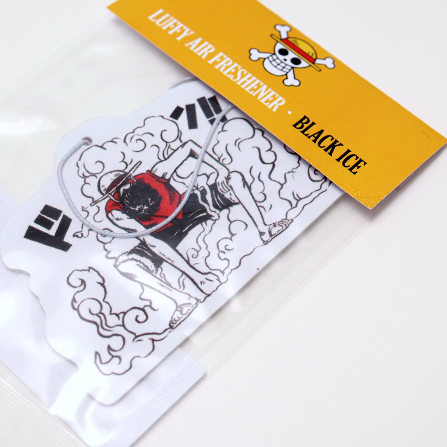 This One Piece Luffy air freshener card Black Ice scent offers a cool, crisp fragrance that keeps your car smelling fresh. Each air freshener comes sealed and includes an elastic tie for easy placement.