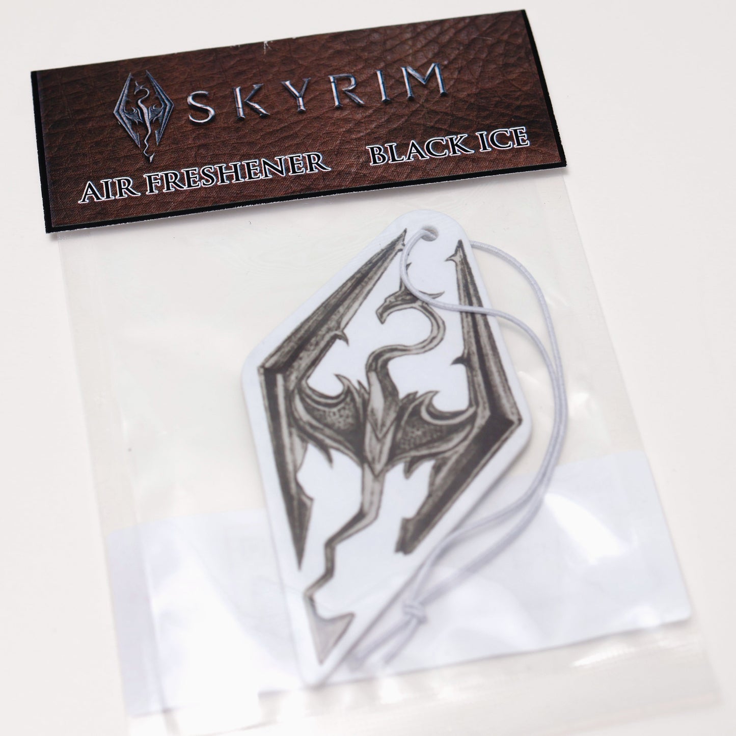 Seal of Akatosh car air freshener card Black Ice scent offers a cool, crisp fragrance that keeps your car smelling fresh. Each air freshener comes sealed and includes an elastic tie for easy placement.