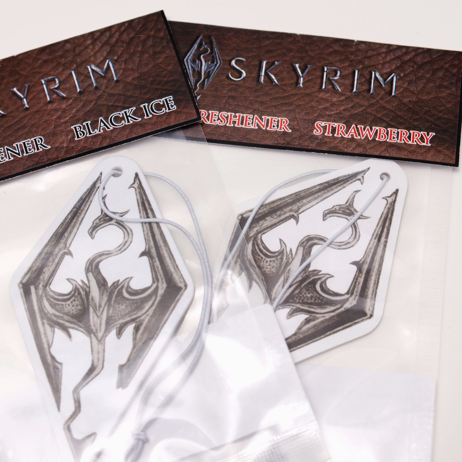 This Seal of Akatosh car air freshener card design inspired by Skyrim available in Black Ice and Strawberry scents. 