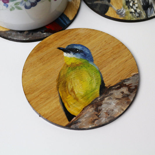 Artysn Studio's eastern yellow robin wooden coaster makes the perfect gift for any bird lover or a perfect addition to enhance your home decor and showcase your passion for Australia's diverse wildlife. Individually hand-painted by our artist using acrylic paints on Eucalyptus wood.