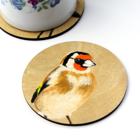 Original Australian art. Hand painted gold finch on wooden coaster. Left side view of head and upper body. Original Australian bird artwork from Artysn Studio.