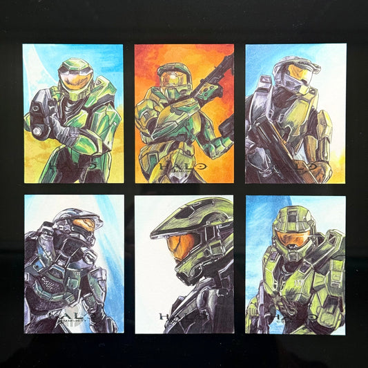 Six‑card Halo art set showing Master Chief’s evolution from CE to Infinite.