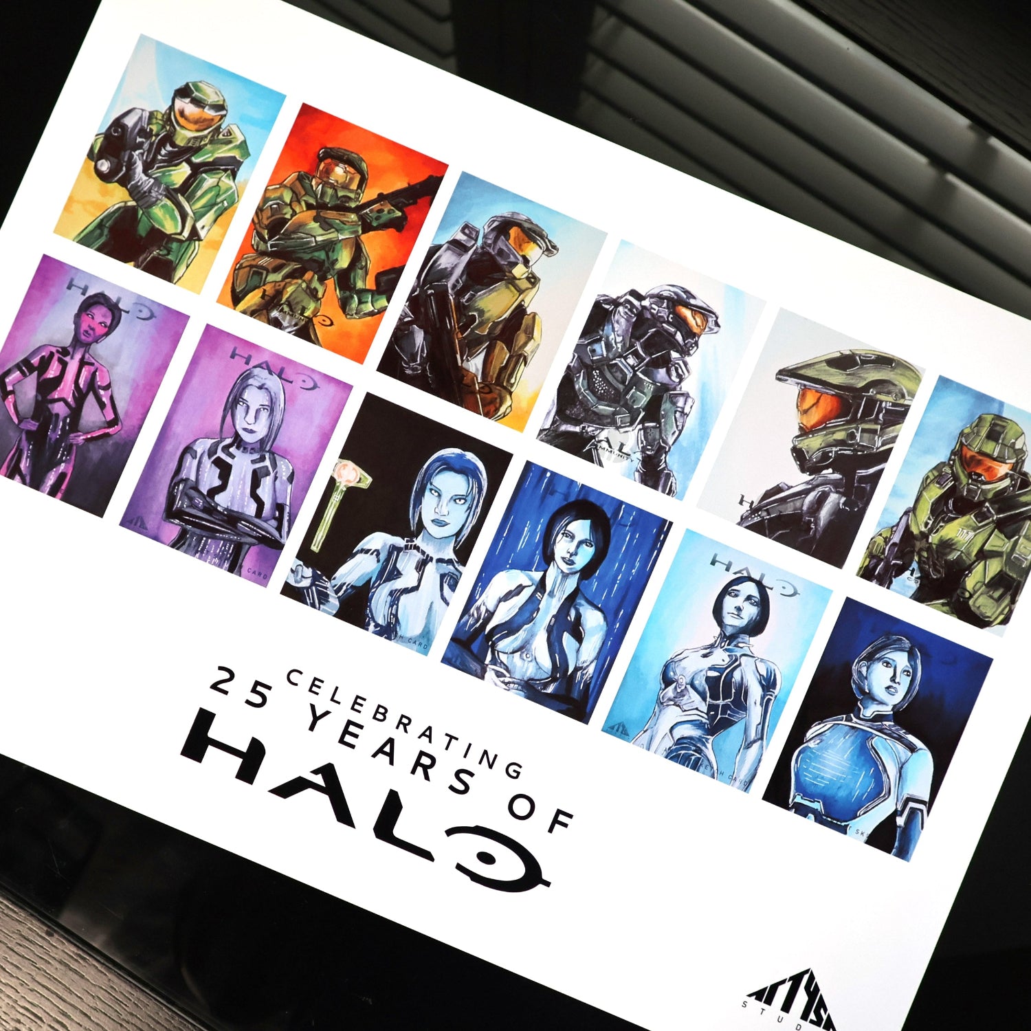 Halo character cards art print celebrating 25 years of the Halo franchise features multiple versions of Master Chief and Cortana.