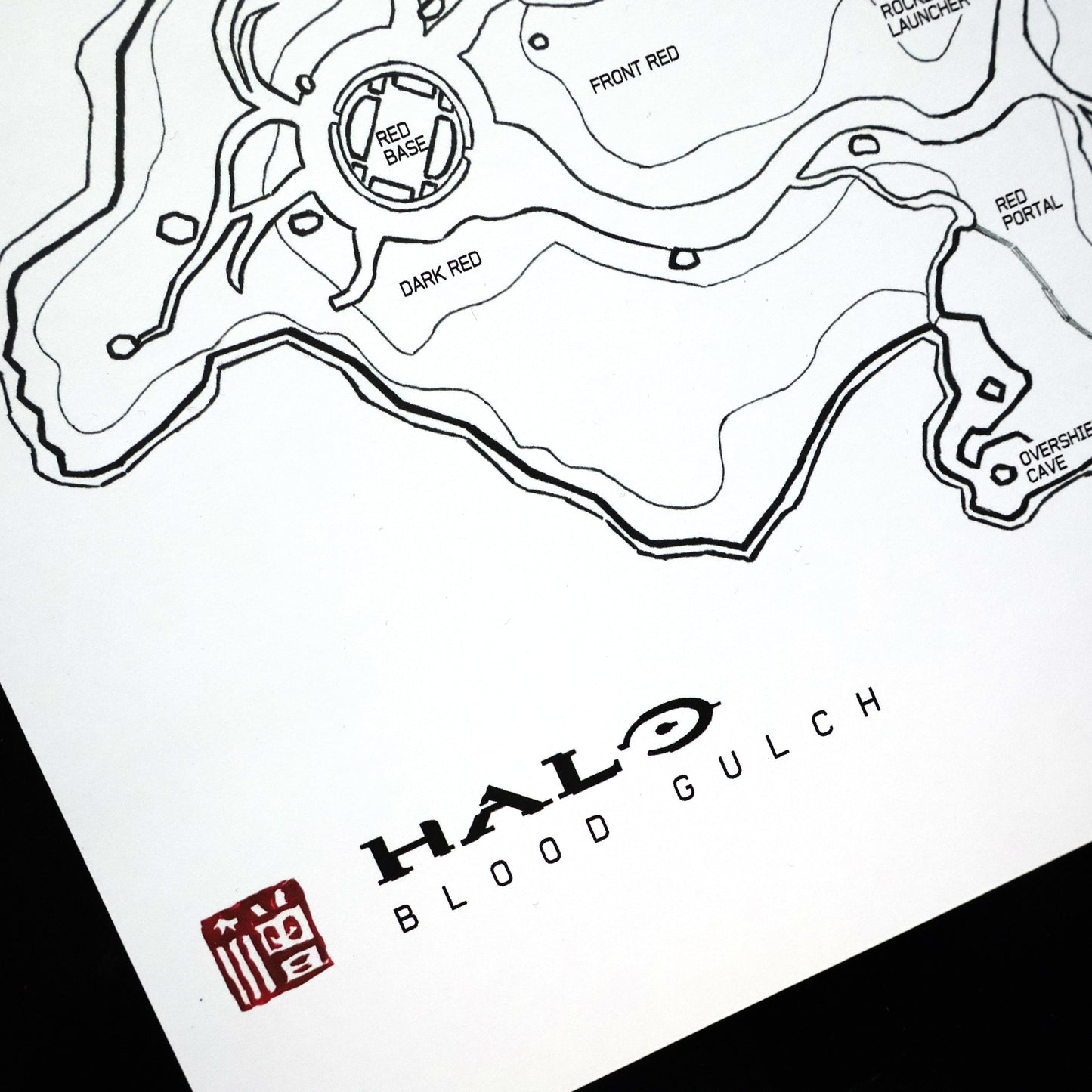 Closeup of hand‑drawn Halo Blood Gulch blueprint map print with Entransing's signature stamp.