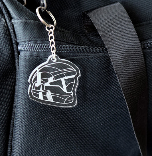 Keychain with halo ODST helmet design attached to a black bag