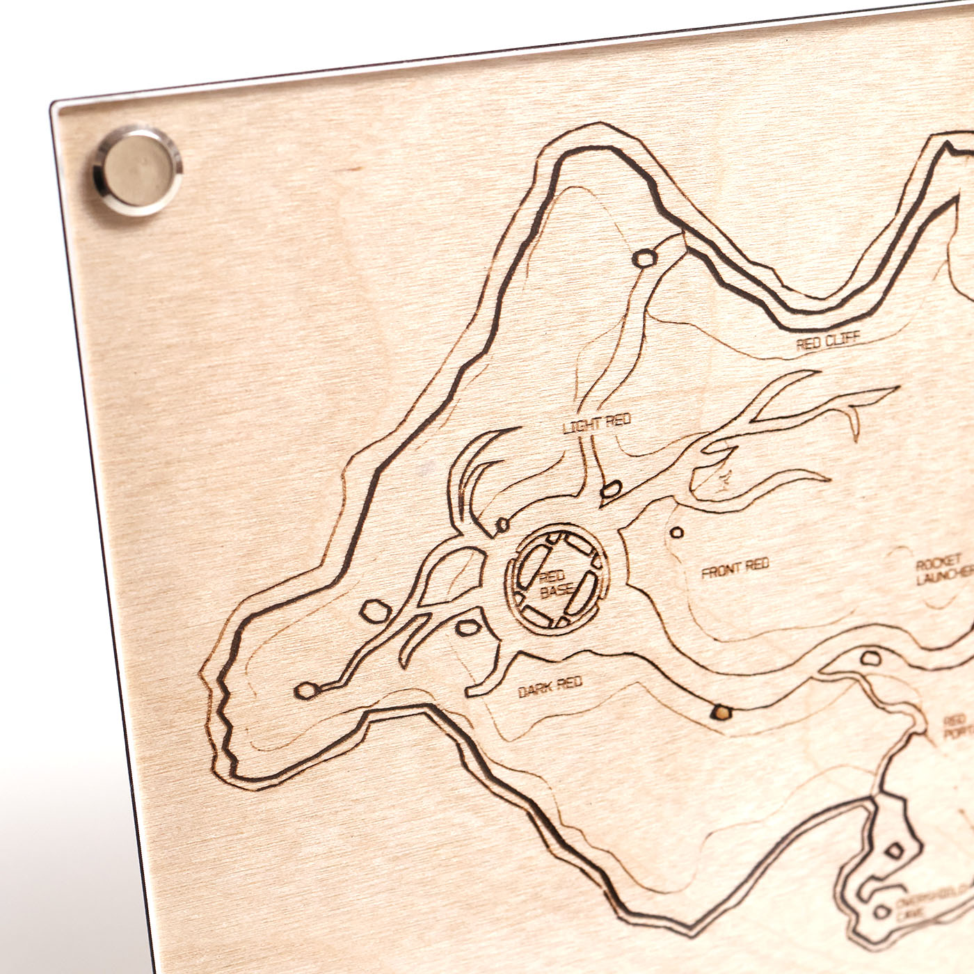Laser‑engraved A5 Blood Gulch map diagram with red base callouts closeup. 