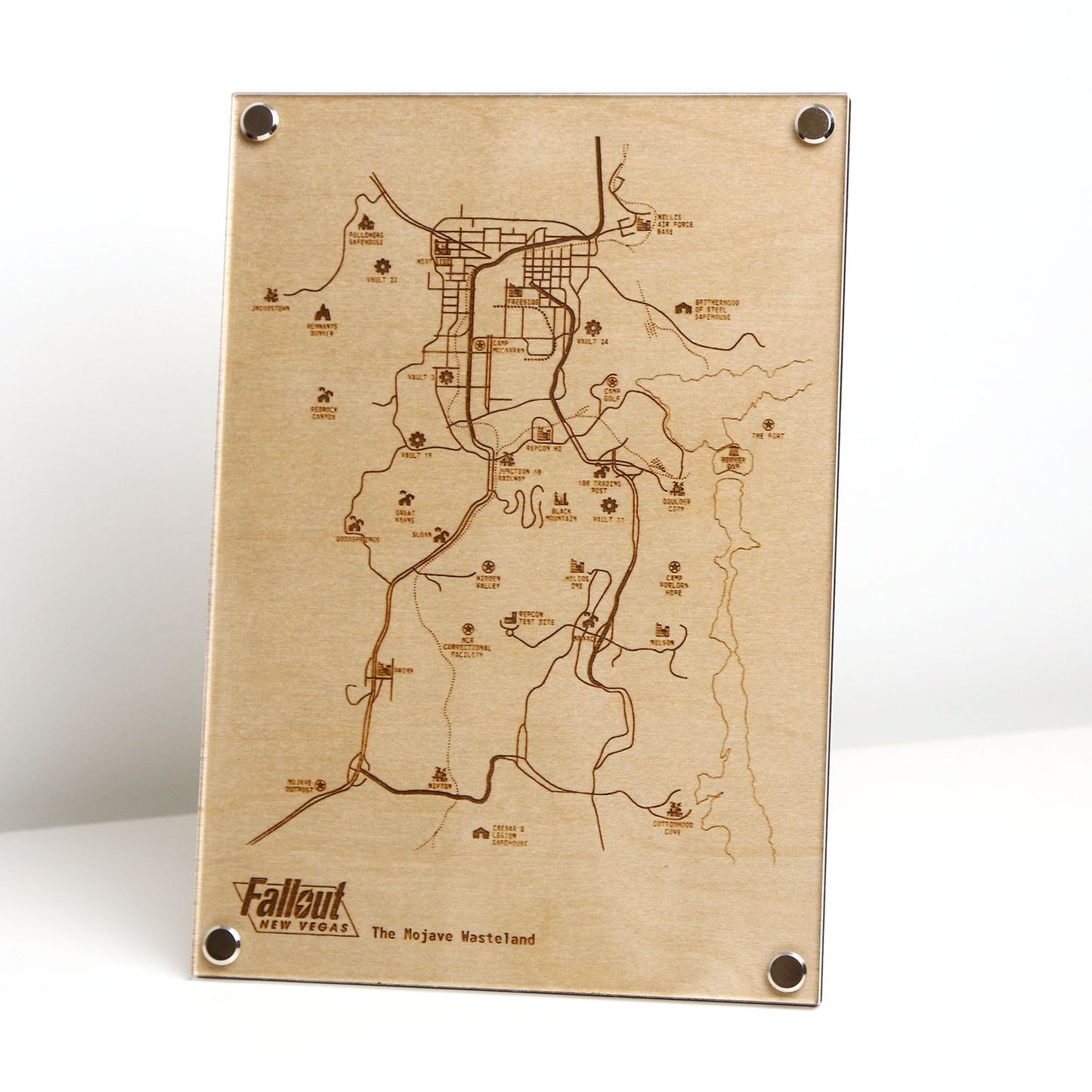 Laser‑engraved Mojave Wasteland map inspired by Fallout New Vegas displayed on table, featuring detailed etched landmarks, routes, and territories for minimalist gaming décor.