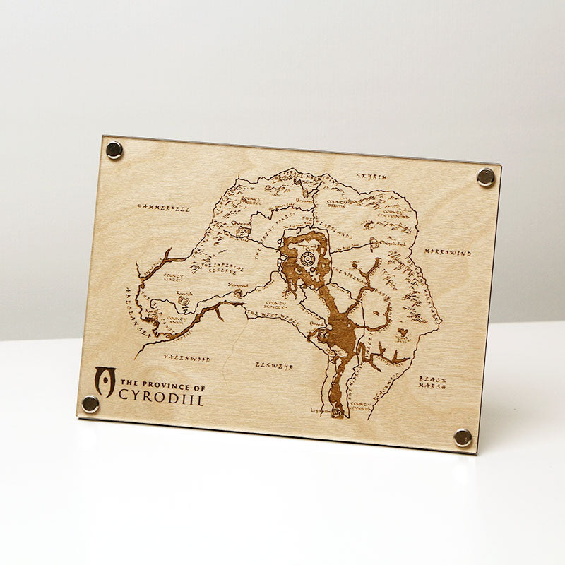 Laser‑engraved map of the Province of Cyrodiil on LayaBoard displayed on table. Featuring detailed etched regions and landmarks inspired by The Elder Scrolls IV: Oblivion.
